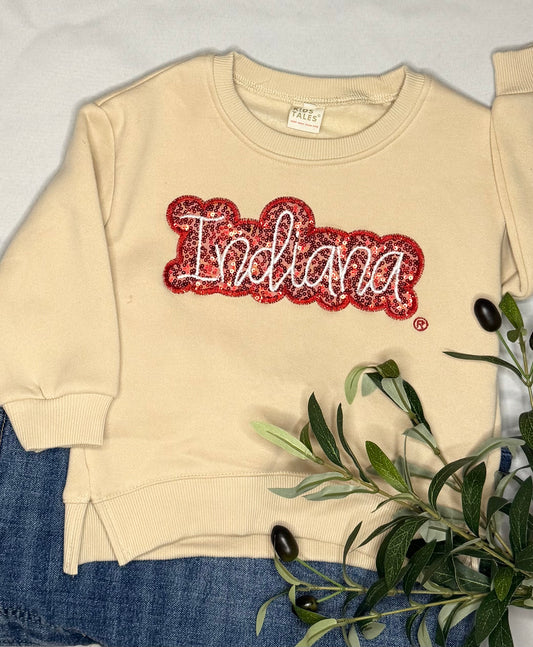 Beige sweatshirt with 'Indiana' text in red sequins